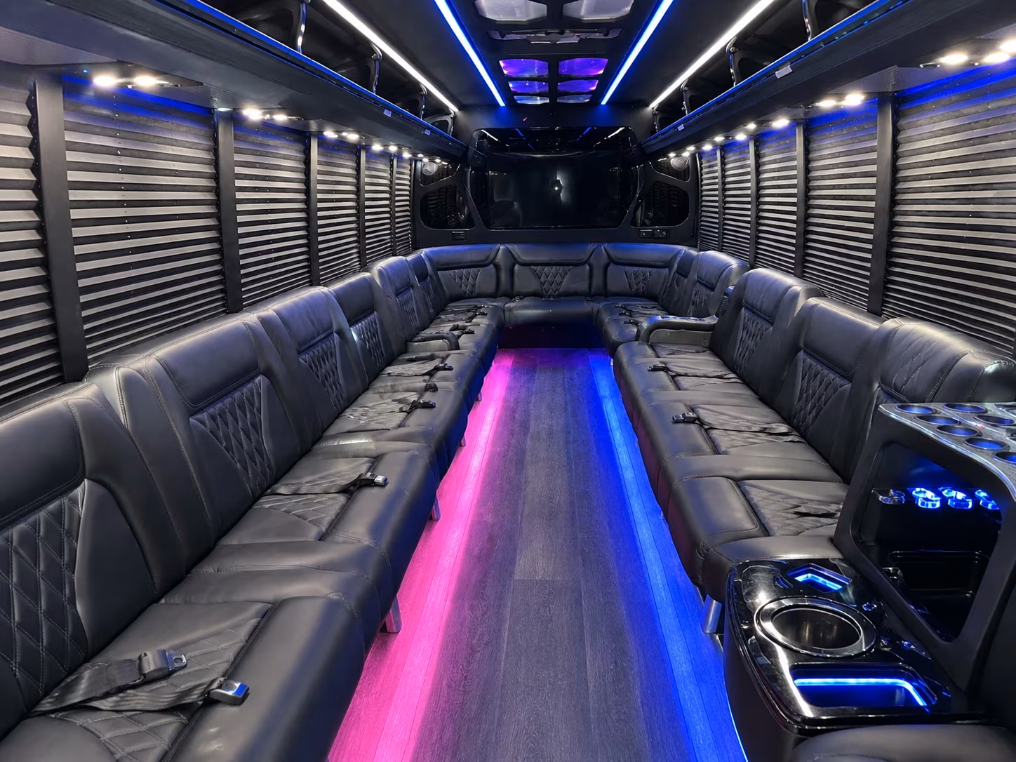 Wedding guests seated inside a party bus serving Addison